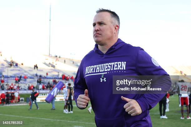 Head coach Pat Fitzgerald of the Northwestern Wildcats runs off the field after losing to the Wisconsin Badgers at Ryan Field on October 08, 2022 in...