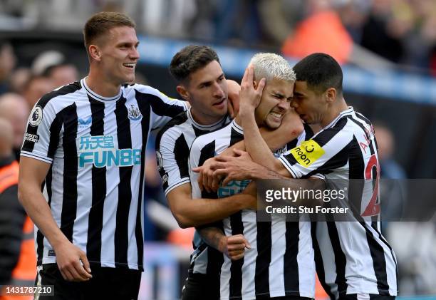 Newcastle player Bruno Guimaraes celebrates his second goal with Sven Botman Fabian Schar and Miguel Almiron during the Premier League match between...