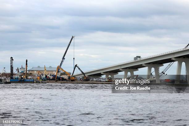 Workers repair the Sanibel causeway after Hurricane Ian passed through the area on October 08, 2022 in Sanibel, Florida. Residents of the island are...