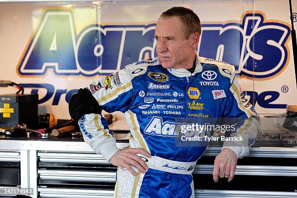 Mark Martin, driver of the Aaron's Dream Machine Toyota, looks on in the garage during practice for the NASACAR Sprint Cup Series 400 at Kansas...