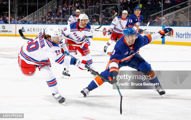 Artemi Panarin of the New York Rangers takes the first period slapshot against Adam Pelech of the New York Islanders at the UBS Arena on October 08,...