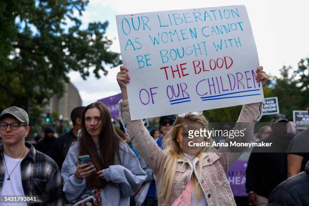 Anti-abortion activists protest near a Women's March rally on Capitol Hill on October 08, 2022 in Washington, DC. The march is a part of a National...