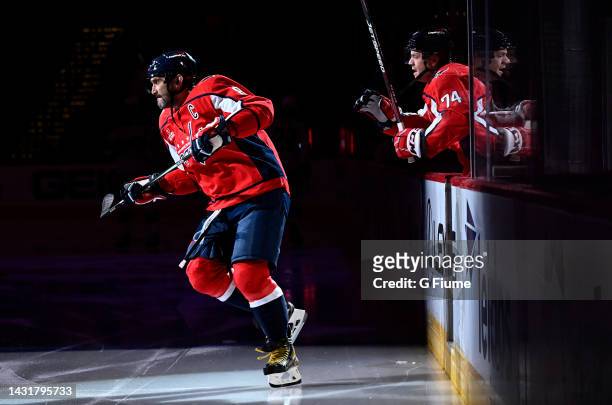 John Carlson and Alex Ovechkin of the Washington Capitals skate onto the ice during introductions before a preseason game against the Columbus Blue...