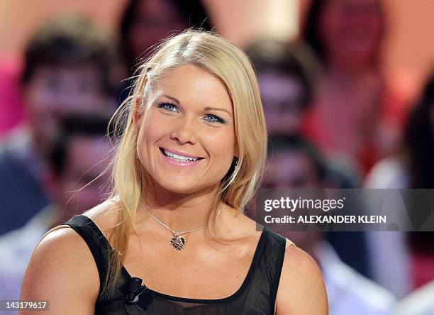 Wrestler Elizabeth Carolan Kocanski, aka Beth Phoenix, takes part in the TV show "Le grand journal" on a set of French TV Canal+, on April 20, 2012...