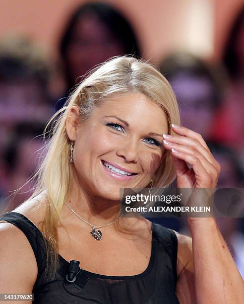 Wrestler Elizabeth Carolan Kocanski, aka Beth Phoenix, gestures as she takes part in the TV show "Le grand journal" on a set of French TV Canal+, on...