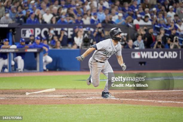 Adam Frazier of the Seattle Mariners hits an RBI double against Jordan Romano of the Toronto Blue Jays to take the lead during the ninth inning in...