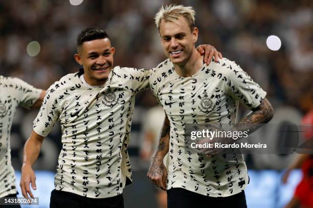 Roger Guedes of Corinthians celebrates with teammate Adson after scoring the second goal of his team during the match between Corinthians and...