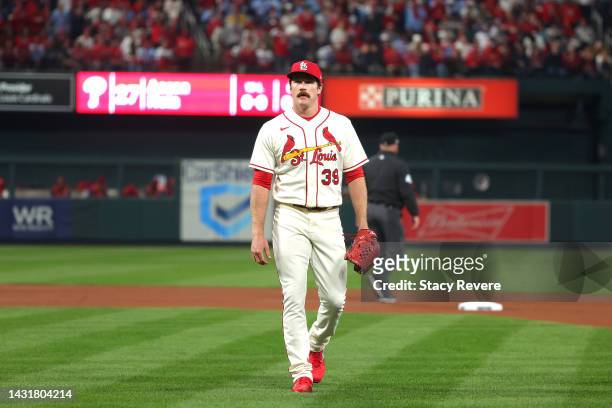 Miles Mikolas of the St. Louis Cardinals walks back to the dugout against the Philadelphia Phillies after closing out the top first inning in game...