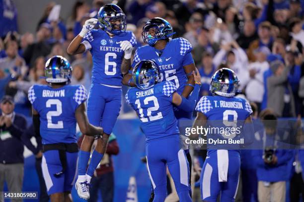 Jordan Dingle of the Kentucky Wildcats celebrates with teammates after scoring a touchdown in the second quarter against the South Carolina Gamecocks...