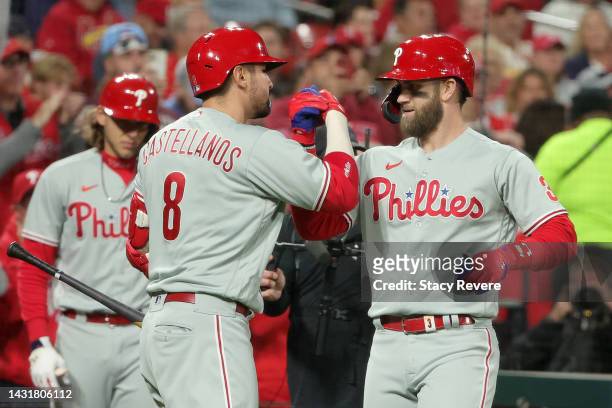 Bryce Harper of the Philadelphia Phillies celebrates with Nick Castellanos after hitting a solo home run against the St. Louis Cardinals during the...