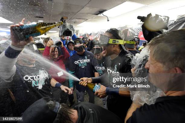 Julio Rodriguez of the Seattle Mariners celebrates with the team in the locker room after defeating the Toronto Blue Jays in game two to win the...