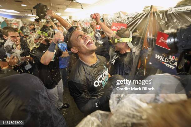 Julio Rodriguez of the Seattle Mariners celebrates with the team in the locker room after defeating the Toronto Blue Jays in game two to win the...