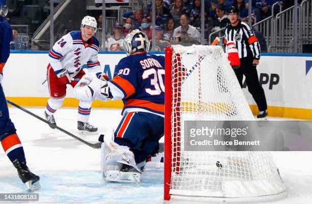 Kaapo Kakko of the New York Rangers scores a third period goal on Ilya Sorokin of the New York Islanders at the UBS Arena on October 08, 2022 in...