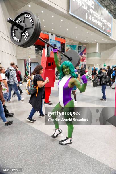 Cosplayer dressed as She-Hulk poses during New York Comic Con 2022 on October 08, 2022 in New York City.