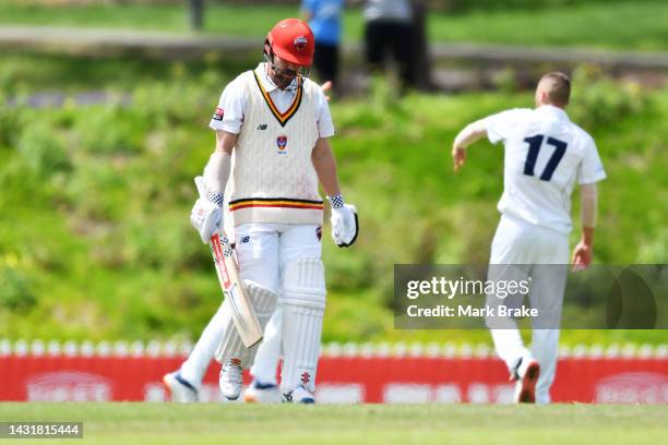 Travis Head of the Redbacks leaves the ground after getting out to Fergus O'Neill of the Bushrangers during the Sheffield Shield match between South...