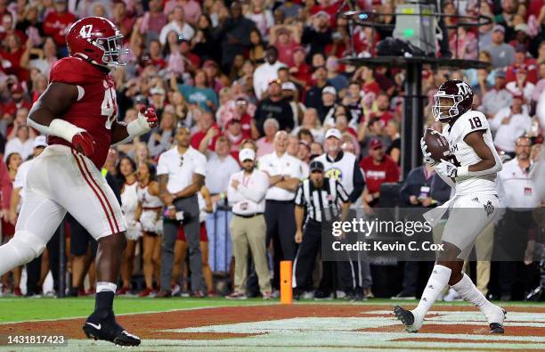 Donovan Green of the Texas A&M Aggies pulls in this touchdown reception against the Alabama Crimson Tide during the first half at Bryant-Denny...