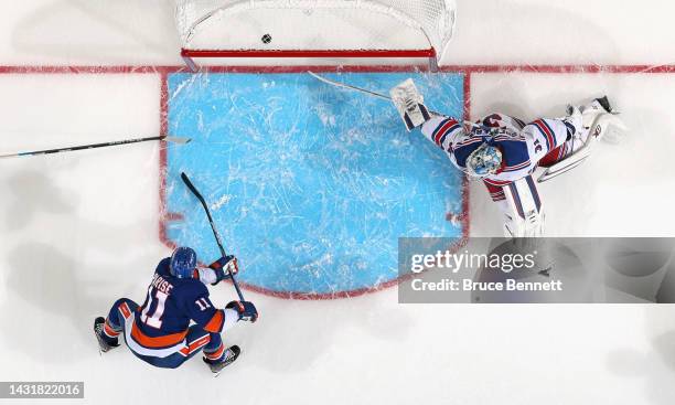 Zach Parise of the New York Islanders scores a third period goal against Igor Shesterkin of the New York Rangers at the UBS Arena on October 08, 2022...