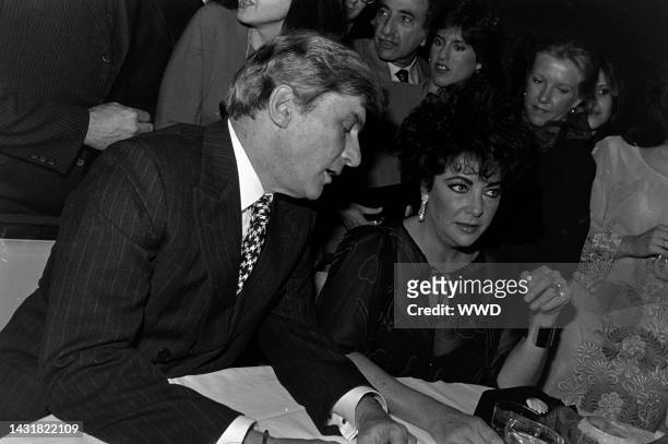 John Warner and Elizabeth Taylor attend a party, following a performance of the play "The Little Foxes," at the Kennedy Center in Washington, D.C.,...