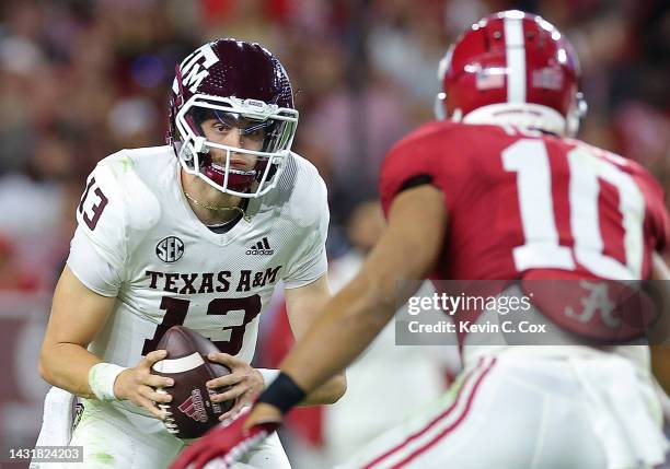 Haynes King of the Texas A&M Aggies looks to pass against the Alabama Crimson Tide during the first half at Bryant-Denny Stadium on October 08, 2022...