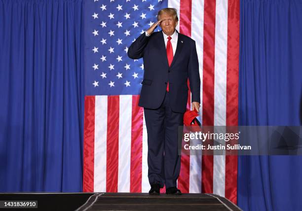 Former U.S. President Donald Trump salutes supporters during a campaign rally at Minden-Tahoe Airport on October 08, 2022 in Minden, Nevada. Former...