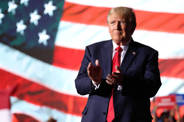 Former U.S. President Donald Trump greets supporters during a campaign rally at Minden-Tahoe Airport on October 08, 2022 in Minden, Nevada. Former...