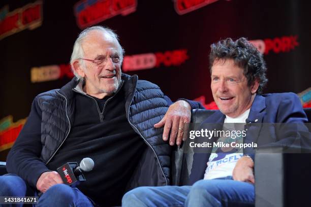 Actors Christopher Lloyd and Michael J. Fox attend a "Back To The Future Reunion" at New York Comic Con on October 08, 2022 in New York City.