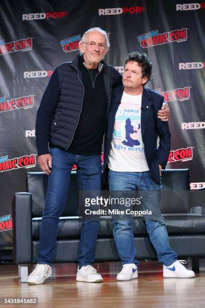 Actors Christopher Lloyd and Michael J. Fox attend a "Back To The Future Reunion" at New York Comic Con on October 08, 2022 in New York City.