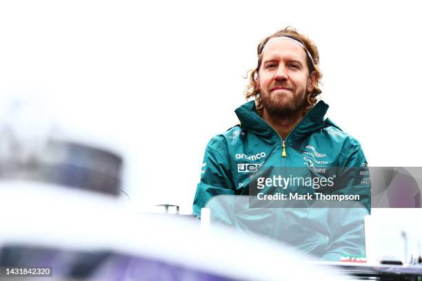 Sebastian Vettel of Germany and Aston Martin F1 Team looks on from the drivers parade prior to the F1 Grand Prix of Japan at Suzuka International...
