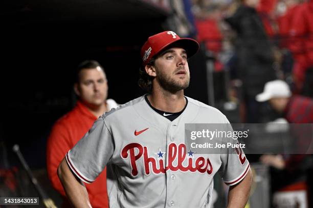 Aaron Nola of the Philadelphia Phillies looks on from the dugout after being relieved against the St. Louis Cardinals during the seventh inning in...