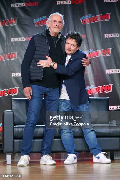 Actors Christopher Lloyd and Michael J. Fox attend a "Back To The Future Reunion" at New York Comic Con on October 08, 2022 in New York City.