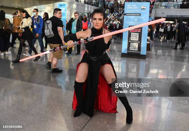 Cosplayer dressed as Rey Skywalker poses during day 3 of New York Comic Con on October 08, 2022 in New York City.