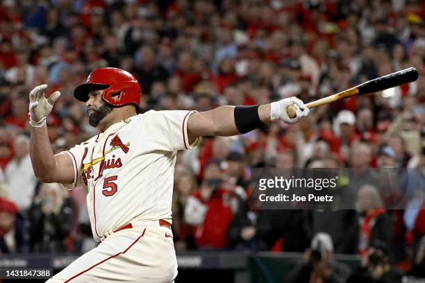 Albert Pujols of the St. Louis Cardinals hits a single to left field against the Philadelphia Phillies during the eighth inning in game two of the...