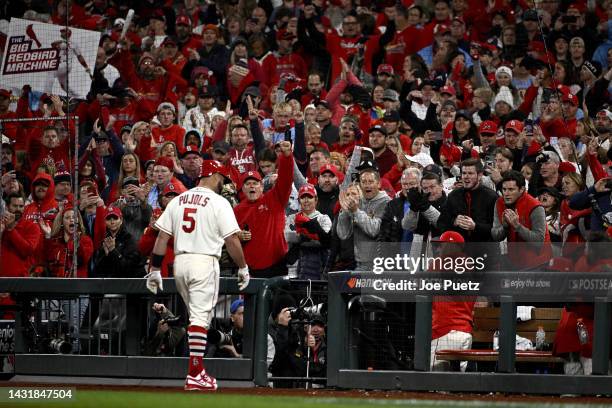 Albert Pujols of the St. Louis Cardinals walks back to the dugout against the Philadelphia Phillies during the eighth inning in game two of the...