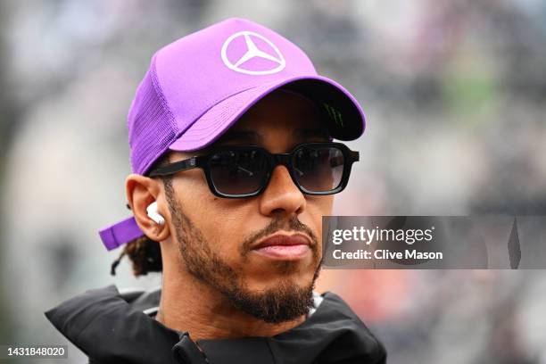 Lewis Hamilton of Great Britain and Mercedes looks on from the drivers parade prior to the F1 Grand Prix of Japan at Suzuka International Racing...