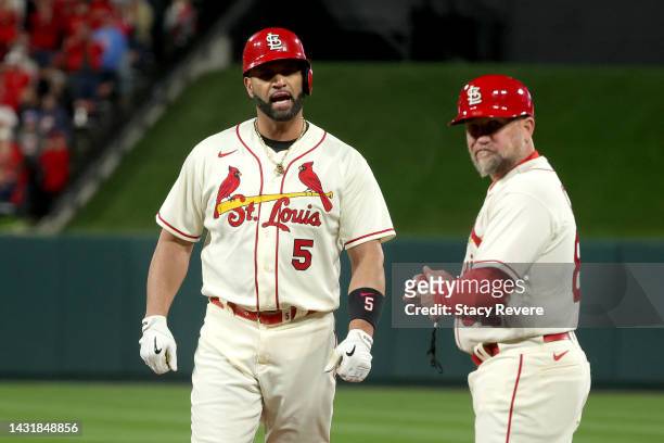 Albert Pujols of the St. Louis Cardinals reacts after hitting a single against the Philadelphia Phillies during the eighth inning in game two of the...