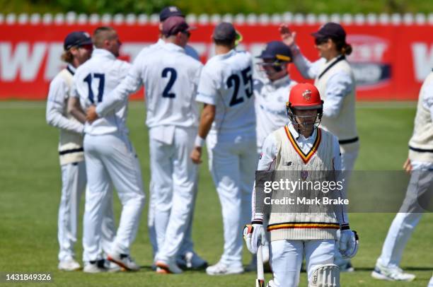 Alex Carey of the Redbacks leaves the ground after getting out to Fergus O'Neill of the Bushrangers caught behind during the Sheffield Shield match...