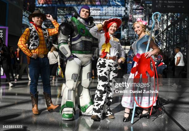 Cosplayers pose as Woody, Buzz Lightyeat, Jessie and Bo Peep from "Toy Story" during day 3 of New York Comic Con on October 08, 2022 in New York City.