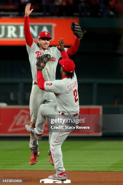 Bryson Stott and Jean Segura of the Philadelphia Phillies celebrate after defeating the St. Louis Cardinals in game two to win the National League...