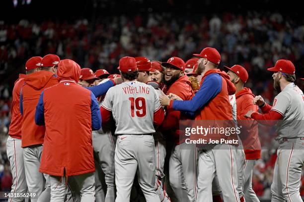 The Philadelphia Phillies celebrate on the field after defeating the St. Louis Cardinals in game two to win the National League Wild Card Series at...