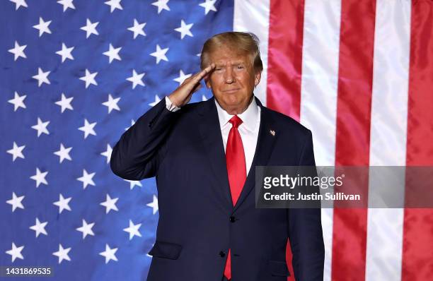 Former U.S. President Donald Trump salutes supporters during a campaign rally at Minden-Tahoe Airport on October 08, 2022 in Minden, Nevada. Former...