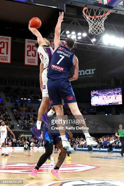 Xavier Cooks of the Kings dunks against Isaac Humphries of United during the round two NBL match between Melbourne United and Sydney Kings at John...