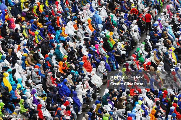 Fans wear ponchos in the rain during the F1 Grand Prix of Japan at Suzuka International Racing Course on October 09, 2022 in Suzuka, Japan.