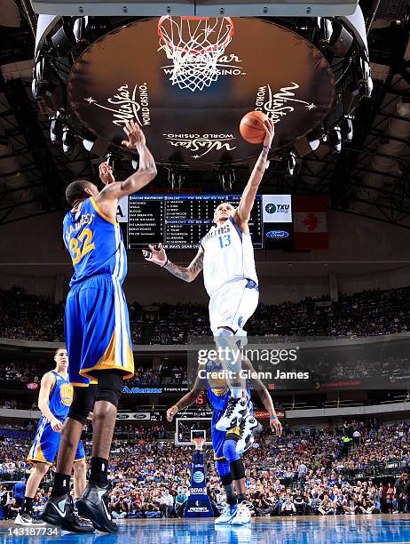 Delonte West of the Dallas Mavericks goes in for the layup against Mickell Gladness of the Golden State Warriors on April 20, 2012 at the American...