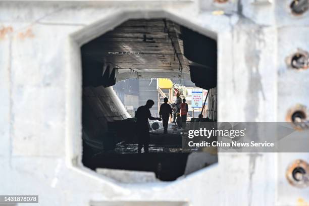 Workers work at the construction site of the Shenzhen-Zhongshan bridge, a part of Shenzhen-Zhongshan Link of the Guangdong-Hong Kong-Macao Greater...