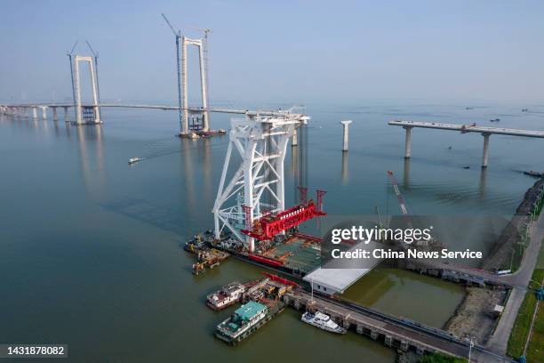 The 155th box girder is loaded to the crane "Tianyi" at the construction site of the Shenzhen-Zhongshan bridge, a part of Shenzhen-Zhongshan Link of...