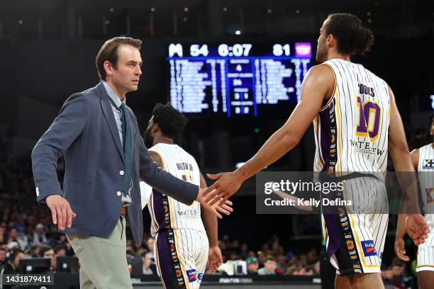 Chase Buford, Head Coach of the Kings and Xavier Cooks of the Kings react during the round two NBL match between Melbourne United and Sydney Kings at...