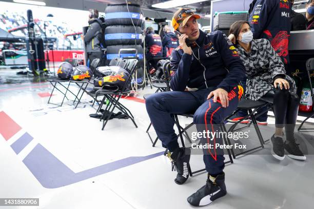 Max Verstappen of the Netherlands and Oracle Red Bull Racing talks on the phone during a red flag delay during the F1 Grand Prix of Japan at Suzuka...