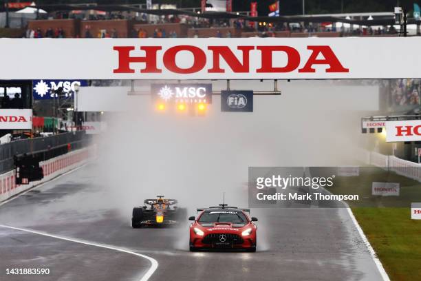 The FIA Safety Car leads the field at the restart after a red flag delay during the F1 Grand Prix of Japan at Suzuka International Racing Course on...