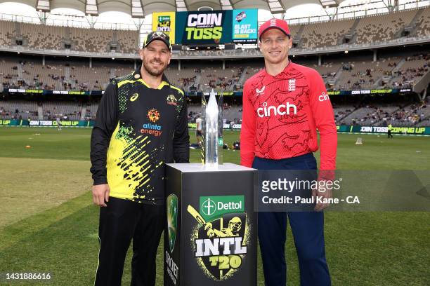 Aaron Finch of Australia and Jos Buttler of England pose with the series trophy prior to the coin toss during game one of the T20 International...