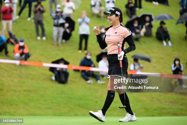 Sakura Koiwai of Japan celebrates winning the tournament on the 18th green during the final round of the Stanley Ladies Honda Golf Tournament at...